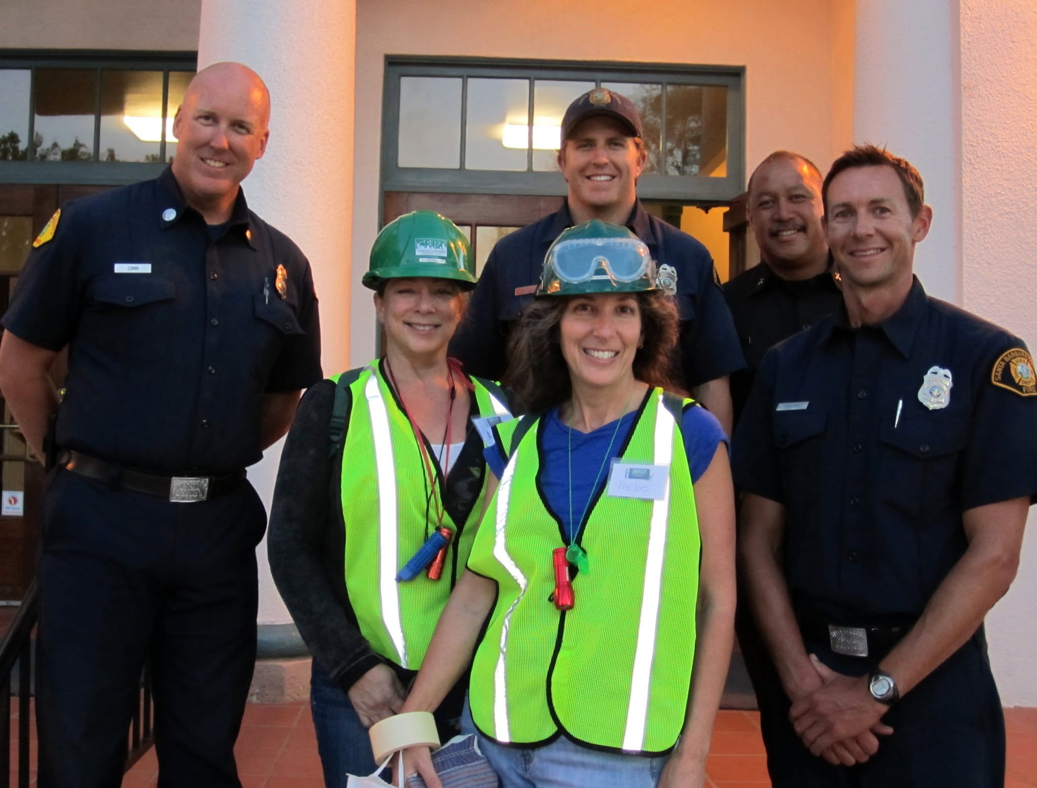 Phebe Mansur participating in a CERT emergency response drill alongside local firefighters